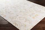 Close-up of Simpatico Candice Olson x LIVABLISS SPO-1001 rug. Cream rug with light blue, mustard, and gray paisley pattern. Corner