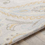 Close-up of Simpatico Candice Olson x LIVABLISS SPO-1001 rug. Cream wool rug with light blue and mustard contemporary pattern. Texture