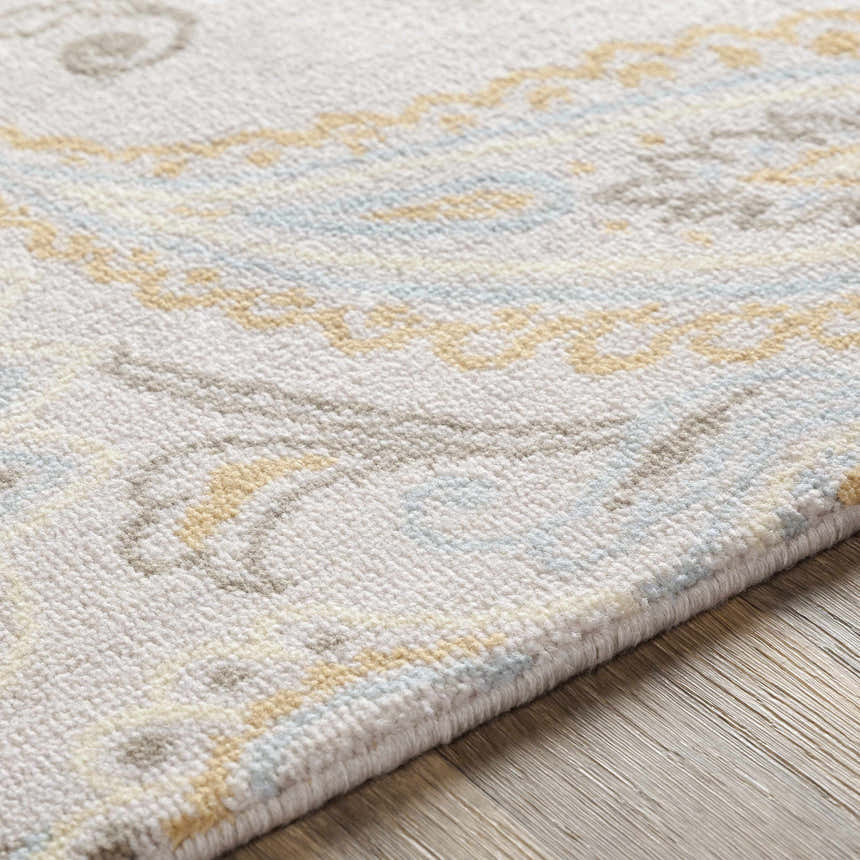Close-up of Simpatico Candice Olson x LIVABLISS SPO-1001 rug. Cream wool rug with light blue and mustard contemporary pattern. Texture