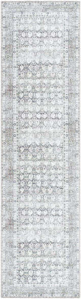 Close-up of the Mabyn Area Rug. Machine-woven polyester runner rug with a distressed geometric pattern in gray and ivory. Design-Runner-2710