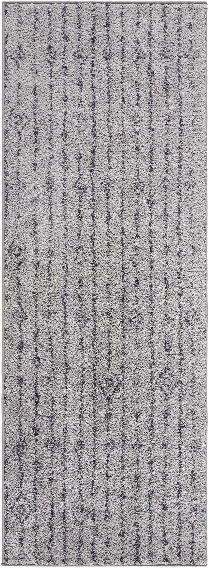 Close-up of the Demi Gray Washable Area Rug, featuring a textured shag design with dark brown vertical stripes on a medium gray base. Design-Runner-2773