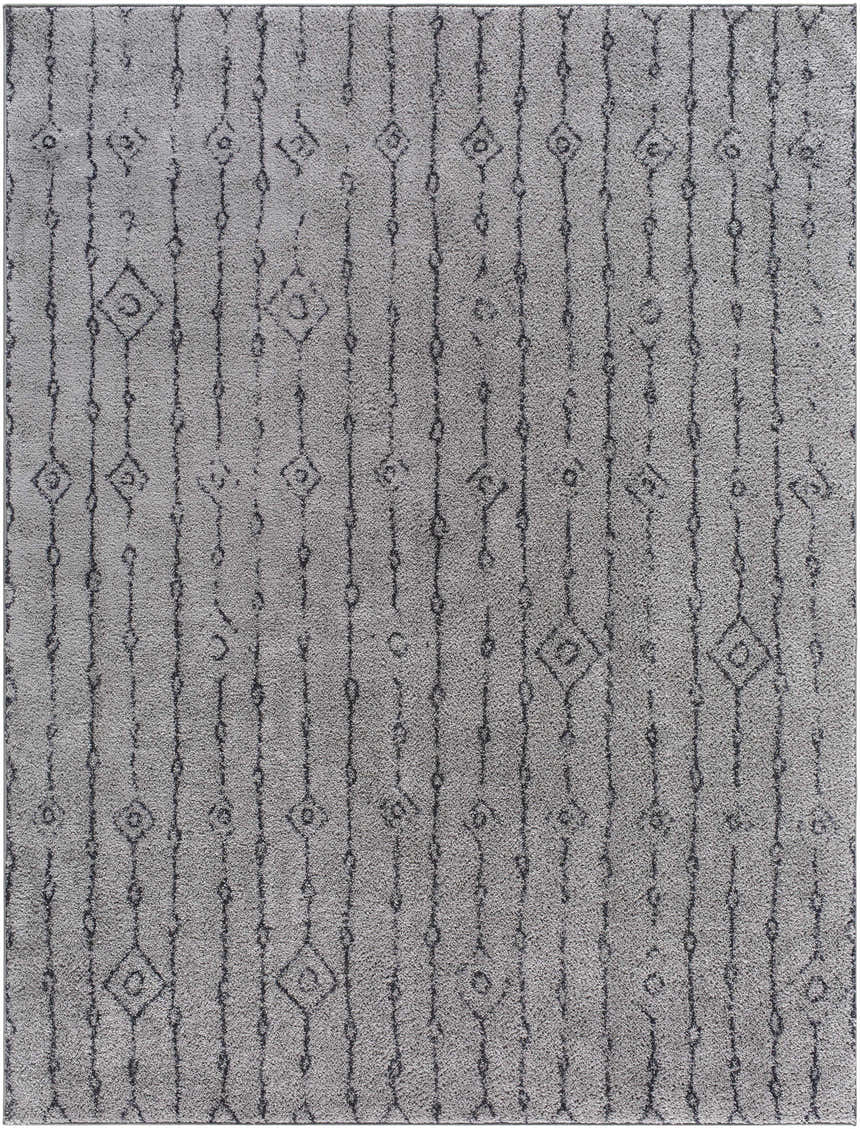 Close-up of the Demi Gray Washable Area Rug, featuring a gray shag texture and dark brown geometric diamond pattern. Design-Rectangle-710106