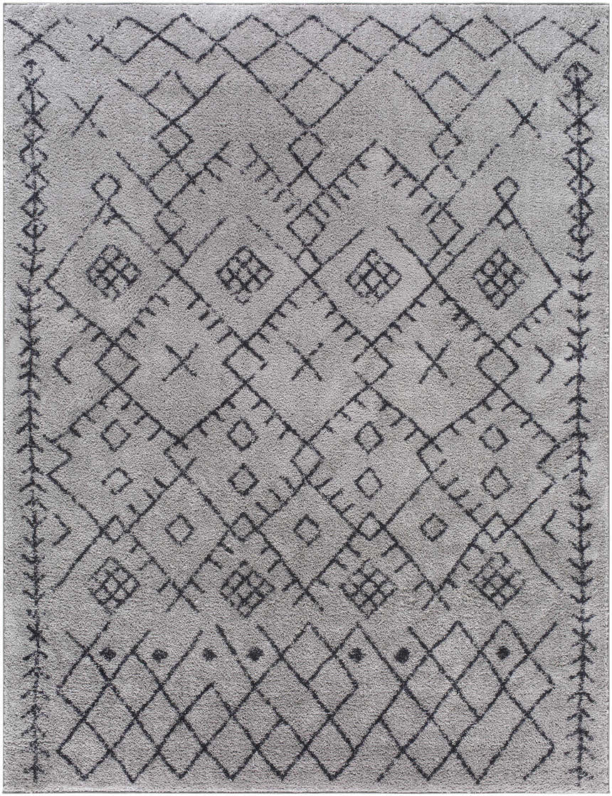 Close-up of the Elyes Gray Washable Area Rug. Farmhouse style shag rug with dark gray geometric patterns on a light gray background. Design-Rectangle-710106