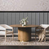 Dining room scene with a round wood table on a charcoal and beige Dion Washable Floral Rug. Roomscene-Rectangle