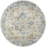 Close-up of a round Ezri Washable Area Rug. Beige, light blue, and orange farmhouse-style rug with traditional medallion pattern. Design-Round-67