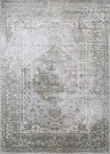 Close-up of Gael Boutique Washable Rug; light blue, olive, and tan vintage pattern with traditional border detail. Design-Rectangle