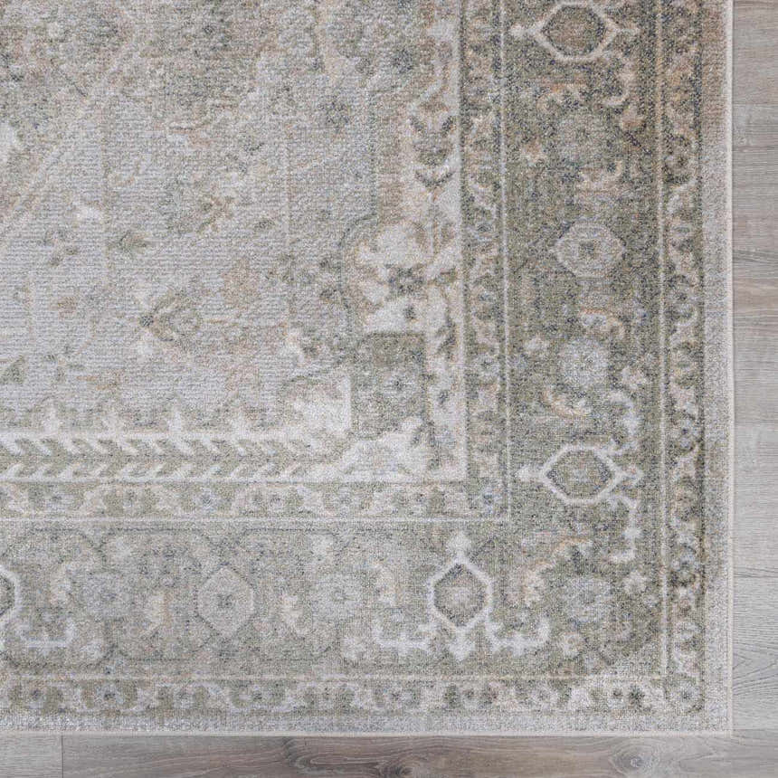 Close up of Gael Boutique Washable Rug showing traditional olive and light blue pattern and soft texture. Swatch