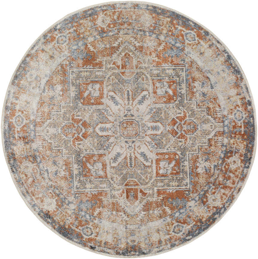 Close-up of round Rust Hera Washable Area Rug. Features a traditional pattern in rust, blue, tan, and off-white hues. Design-Round-67