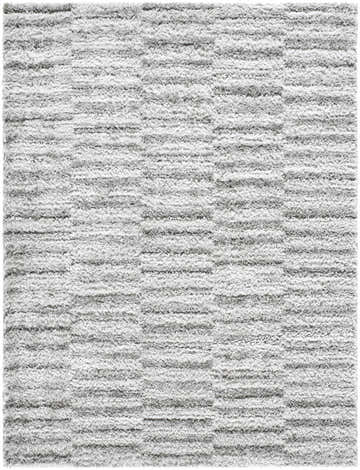 Close-up of the Anevay Dark Gray Area Rug, a soft shag rug with a subtle light slate and gray striped pattern. Design-Rectangle-537