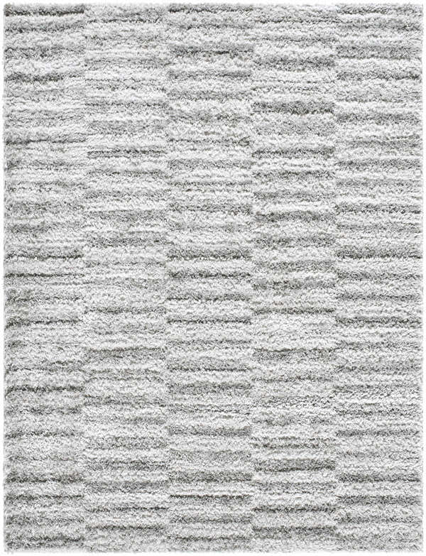 Close-up of the Anevay Dark Gray Area Rug, a soft shag rug with a subtle light slate and gray striped pattern. Design-Rectangle-537