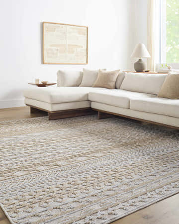 Living room with bone sectional sofa and Alvan 3D Washable Rug in mocha and gray with geometric pattern. Roomscene-Rectangle
