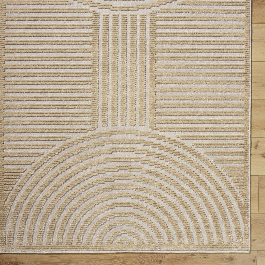Close-up of the Deron Beige Washable Area Rug featuring a contemporary geometric pattern in beige and light brown. Corner