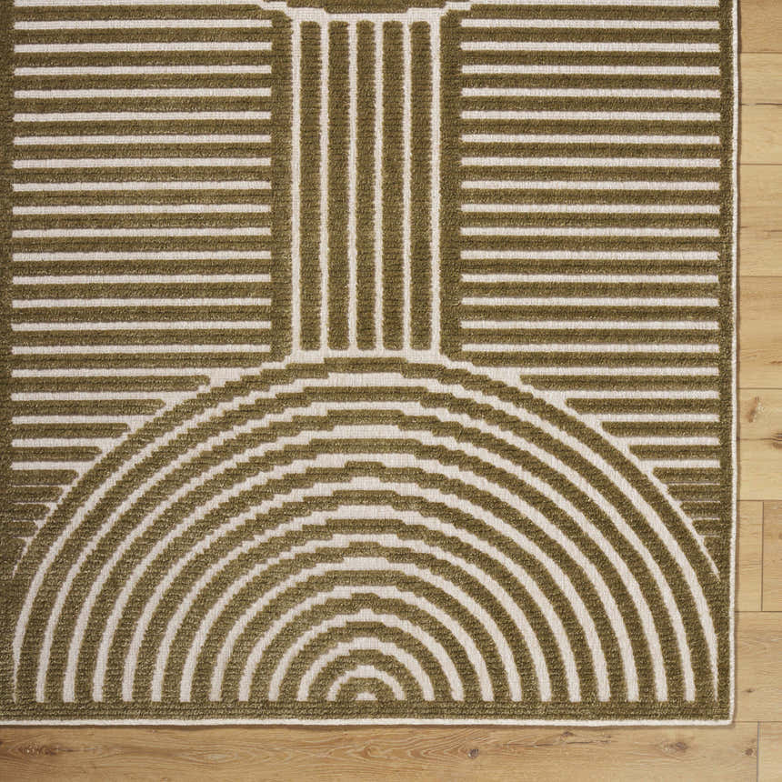 Close-up of the Deron Khaki Washable Area Rug, showcasing its olive and white geometric pattern and machine-woven texture. Corner