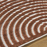 Close-up of the Deron Brown Washable Area Rug, featuring a contemporary brown and white striped pattern. Texture