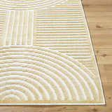 Close-up of the Deron Mustard Washable Area Rug showing its geometric beige and off-white striped pattern and soft texture. Front