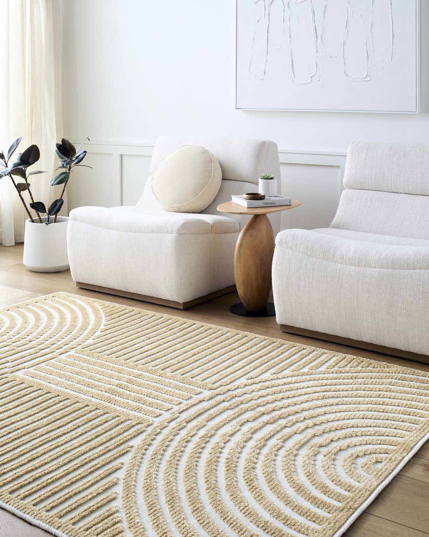 Minimalist living room with beige Deron Mustard Washable Area Rug, white chairs, wood side table, and neutral decor. Roomscene-Rectangle