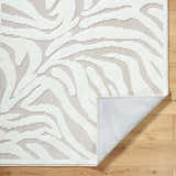Close-up of the Keto Off-White Washable Area Rug showing its textured, light gray and off-white contemporary design. Fold