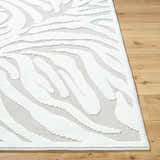 Close-up of the Keto Off-White 3D Washable Area Rug showing the textured off-white leaf pattern on a light gray background. Front