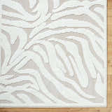 Close-up of the Keto Off-White 3D Washable Area Rug. Features a textured, abstract pattern in off-white and light gray. Contemporary style. Corner