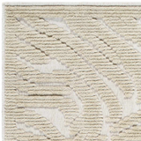 Close-up of the Keto Beige Washable Area Rug. Features a textured, geometric pattern in beige and light brown hues. Texture