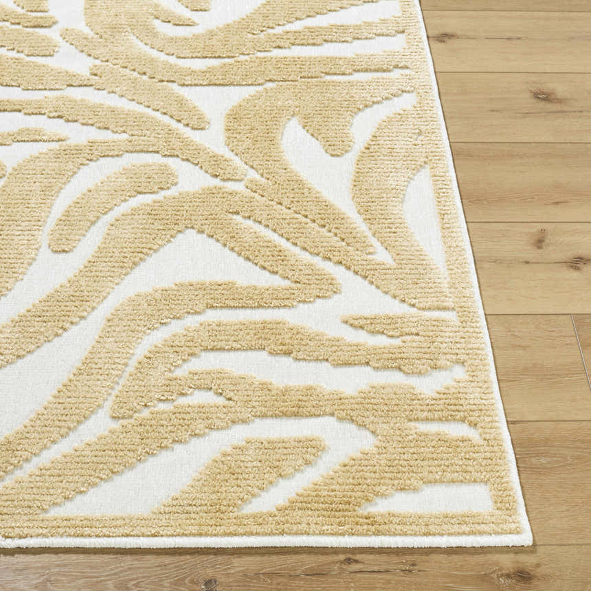 Close-up of the Keto White Washable Area Rug. Features a mustard abstract pattern on a white background. Front