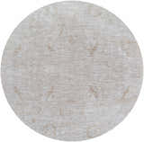 Close-up of round Katia Area Rug. Light gray and natural gray farmhouse style with subtle traditional pattern. Design-Round-67