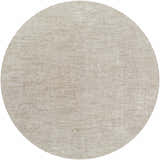 Close-up of the round Kyran Area Rug in light gray and natural gray, featuring a subtle traditional pattern. Design-Round-67