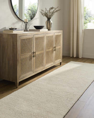 Entryway with a light wood cabinet and Sevan Cream Wool Area Rug runner on hardwood floors. Roomscene-Runner