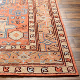 Close-up of the hand-knotted Sandymount Area Rug. Features a traditional oriental design in coral, blue, beige, and tan colors. Front