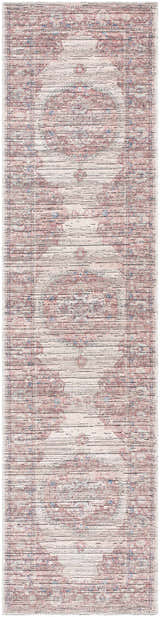 Close-up of the Maja Area Rug. Farmhouse style rug in beachhouse, red, and blue tones with a traditional pattern. Design-Runner