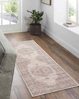 Entryway with Maja Area Rug runner in beachhouse tones, light gray walls, wood floors, and natural light. Roomscene-Runner
