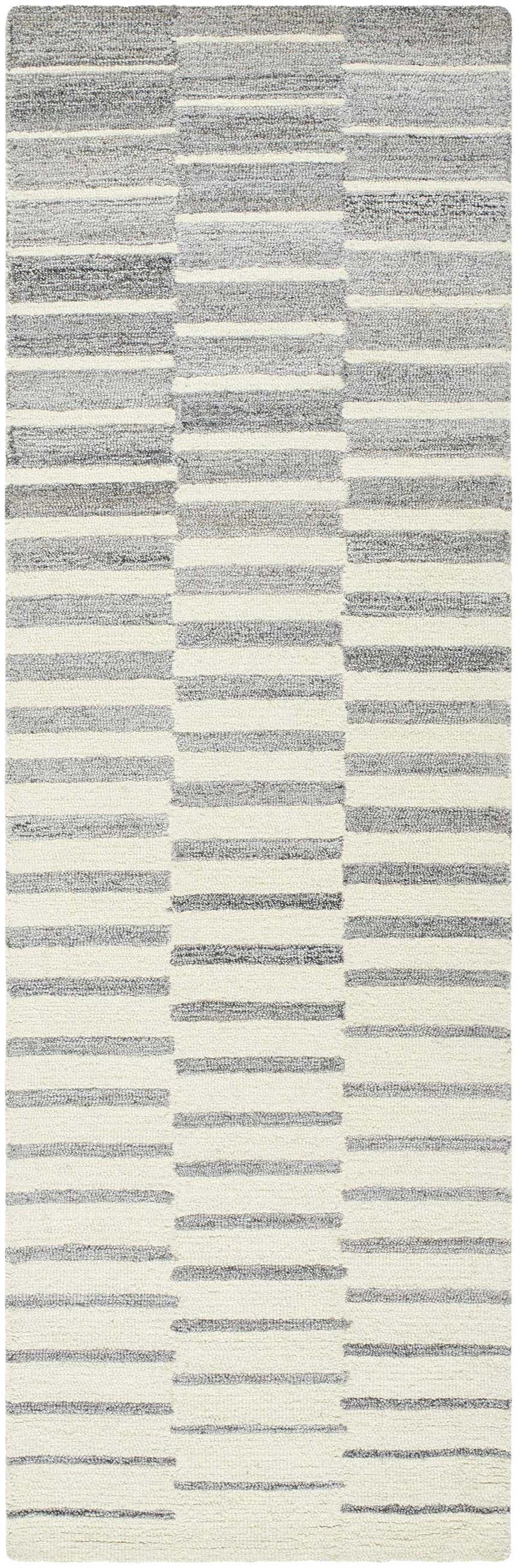 Close-up of the hand-tufted Gawel Gray Area Rug, featuring a contemporary striped pattern in gray, light gray, and charcoal. Design-Runner-268
