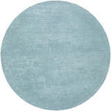 Close-up of the round Nuray Area Rug in gray and pewter, showing its subtle texture and hand-tufted construction. Design-Round-8