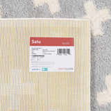 Close up of the Satu Blue Area Rug reverse, showing the weave and construction details. Corner