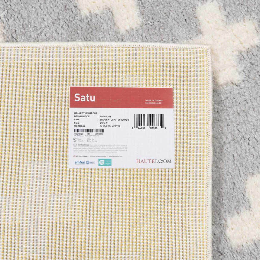 Close up of the Satu Blue Area Rug reverse, showing the weave and construction details. Corner