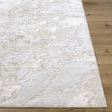 Close-up of the Jaren Tan Area Rug showing its beige, cream, and tan contemporary pattern and soft texture. Front
