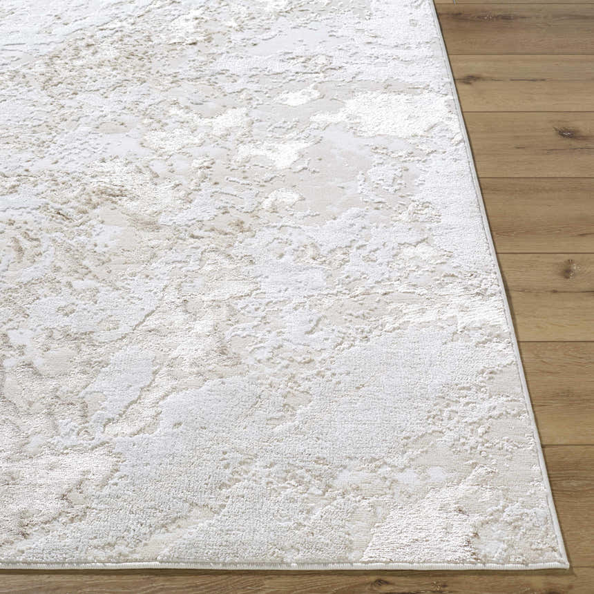 Close-up of the Jaren Tan Area Rug showing its beige, cream, and tan contemporary pattern and soft texture. Front