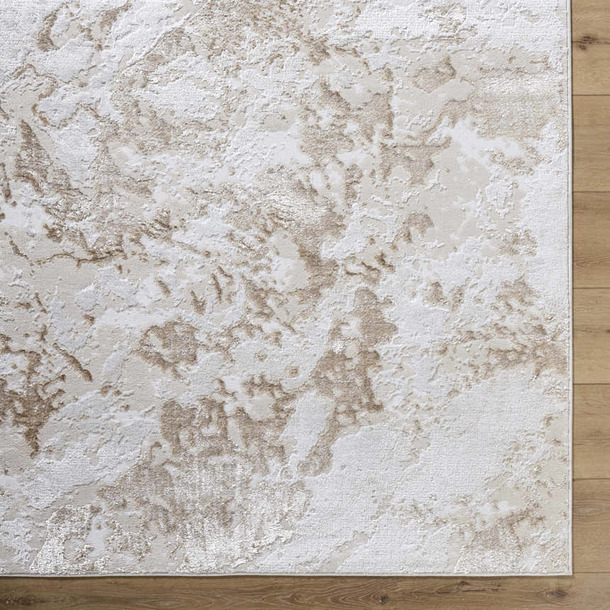 Close up of the Jaren Tan Area Rug showing beige, cream, and tan abstract pattern and texture. Corner