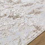 Close up of the beige and cream Kaleo Area Rug showing its contemporary pattern and soft texture. Texture