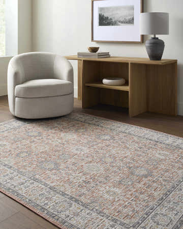 Living room scene with a light gray chair and Adilet Dark Pink Washable Area Rug. Roomscene-Rectangle