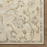 Close-up of the beige Adelle Tufted Oushak Area Rug showing the wool texture and traditional floral pattern. Corner