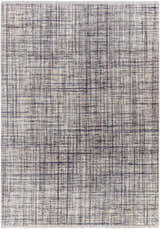 Close-up of the Taysan Area Rug, showcasing its dark gray, purple, and taupe linear pattern and soft polyester texture. Design-Rectangle-57