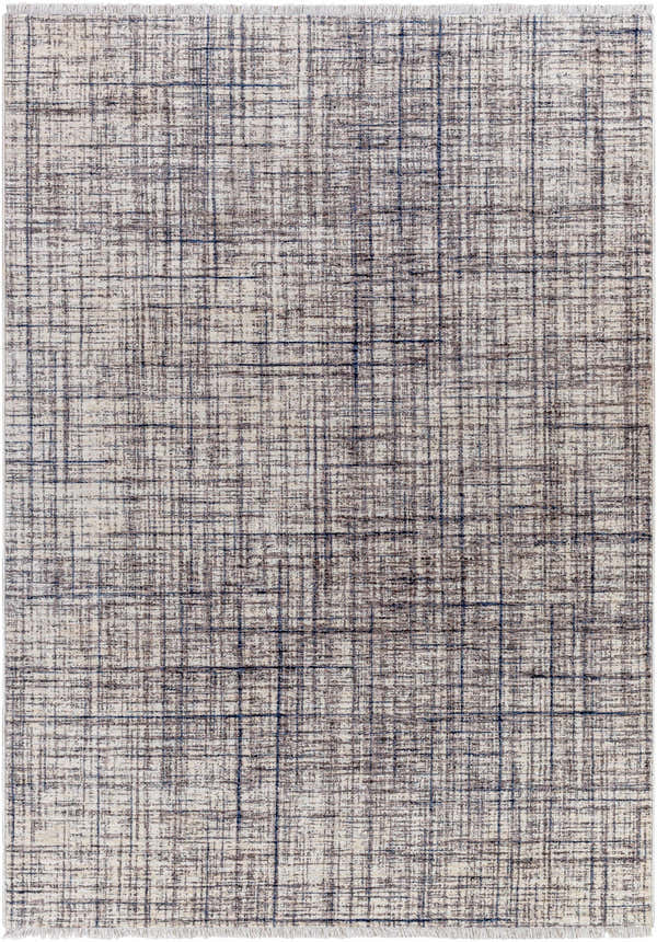 Close-up of the Taysan Area Rug, showcasing its dark gray, purple, and taupe linear pattern and soft polyester texture. Design-Rectangle-57
