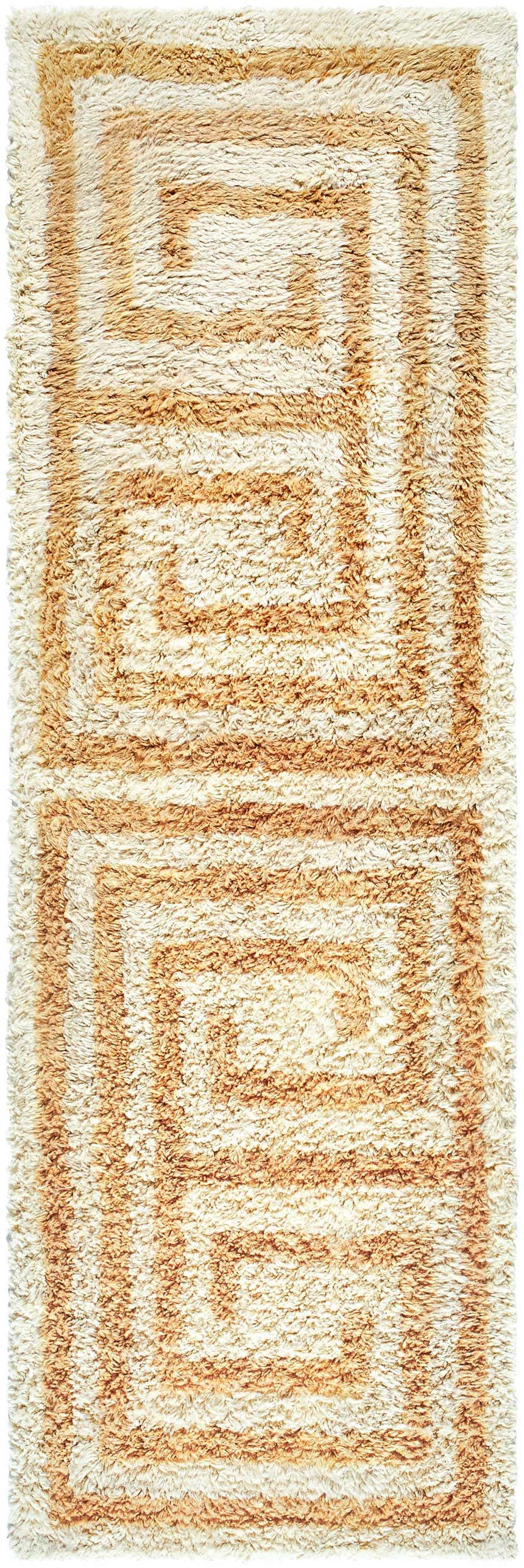 Close-up of the hand-tufted Wasim Area Rug. Brick red, camel, and tan wool rug with a geometric, Southwestern-inspired pattern. Design-Runner-268