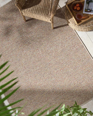Close-up of the Thanh Beige Area Rug showing its woven texture and beige, coral, and mustard color variations. Roomscene-Rectangle