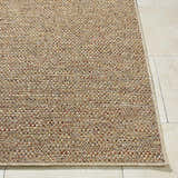 Close-up of the machine woven Thanh Beige Area Rug showing its beige, coral, mustard, and terracotta tones. Front