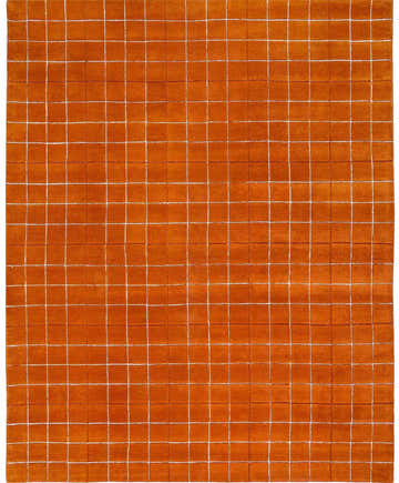 Close-up of the Toshi Rust Area Rug, a hand-tufted wool rug with a tan grid pattern on a rust-colored background. Design-Rectangle