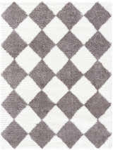 Close-up of Achaia Dark Gray Area Rug with a diamond pattern in gray and ivory shag texture. Design-Rectangle-537