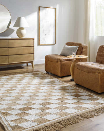Living room scene with brown leather chairs and Tiria Diamond Checkered Jute Tasseled Rug in brick red, camel, and off white. Roomscene-Rectangle