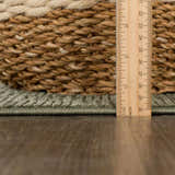 Close-up of the green Truls 3D Checkered Washable Rug showing the texture and thickness, measured with a ruler. Pile